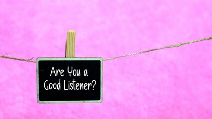 Are You a Good Listener? Symbolic. The concept of Are You a Good Listener? is written on a hanging...
