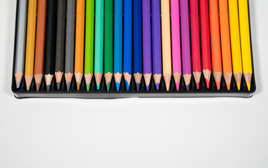 Colored Wooden Pencils Artist Set in Box,Top view of box with colorful pencils. Rainbow colors and...