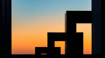 Fototapeta premium Silhouette of modern architecture against a vibrant sunset sky.
