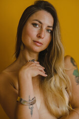 Naked girl with long hair wearing jewelry
