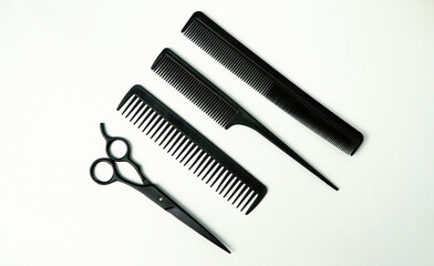 Professional Hairdressing Tools: Combs and Scissors on White