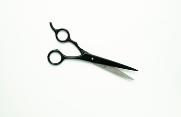 Professional Hair Cutting Scissors: Black Barber Shears on White Background