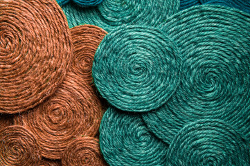 Green and red background made of hard woolen textile material close-up. Fabric with natural texture. Fabric background