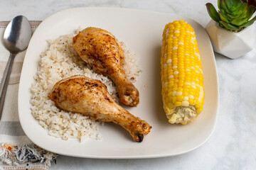 chicken drumsticks with rice and  corn