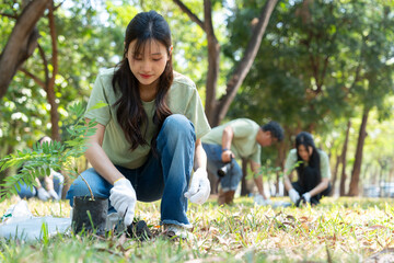 The volunteers show responsibility and teamwork as they collaborate to plant trees and care for...