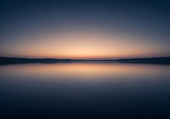 Obraz premium Serene twilight glow reflecting on a calm and tranquil water surface