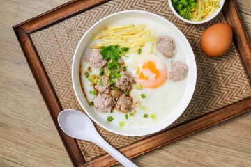 Congee or rice porridge with pork and eggs , thai food, asian food, chinese food