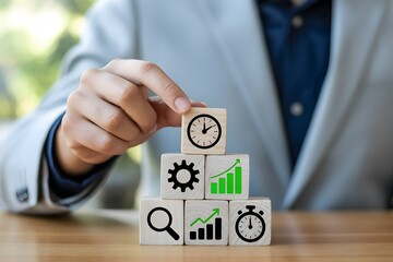 Businessman carefully stacking wooden blocks with business growth icons and clock symbols representing effective time management and strategic planning for success