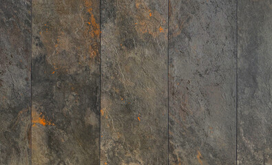 Weathered natural stone texture background with rust-colored accents. Dark gray, brown, and...
