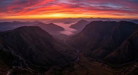 Peaceful mountain landscape bathed in warm sunrise glow