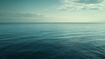 Obraz premium Tranquil ocean vista under a hazy sky