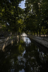 Les Quais de la Fontaine leading to the Jardins de la Fontaine in the centre of Nimes France