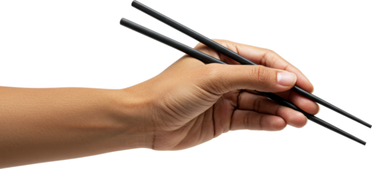 Using black chopsticks with his left hand