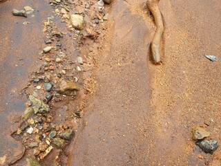 Water flowing and sand