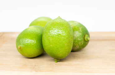 Set of delicious limes, isolated on white background.
