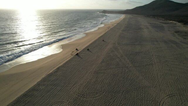 Drone Flight Over Scenic Coastline and Crashing Waves with Four ATV Riders &ndash; BCS, Mexico