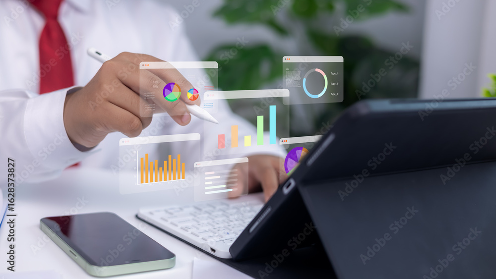 Poster analytics dashboards and floating holographic charts displayed as a person uses a stylus on a tablet