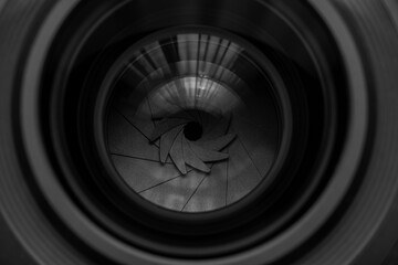 Macro camera lens,Photo Camera or Video lens close-up on black background, objective, concept of photographer camera man job, looking for a photographer, journalist, a videographer to work black.