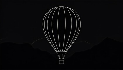 Hot air balloon silhouette against dark mountains