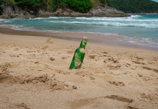 Bottle Glass Of Water On The Beach