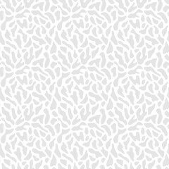 Abstract vector organic pattern. Subtle seamless texture with organic cut-out shapes, spots, blots. Simple trendy background. White and gray color. Repeated minimal design for print, decor, wallpaper