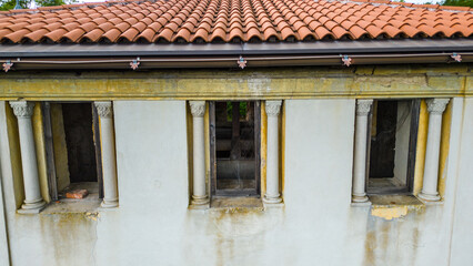 Aerial drone view of Bosiljevo Castle, a historic medieval fortress located in Karlovac County, Croatia, surrounded by dense green forest in summer