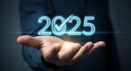 Person holding glowing 2025 with checkmark in open hand year future
