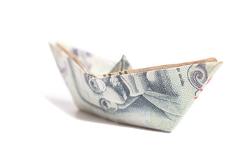 Money origami boat with One hundred rupee note (Indian currency) isolated on white