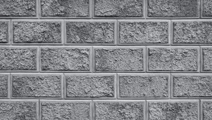 The weathered bricks wall with stucco and rough surface. Decorative grungy background or backdrop.