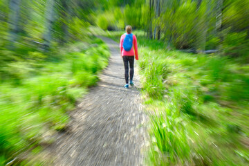 Woman Hiking in Wilderness Mountains Exploring for Exercise Zoom Blur