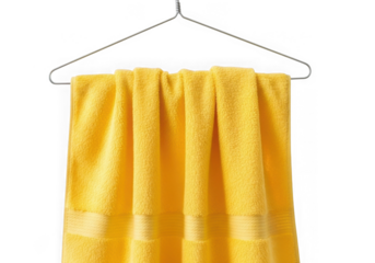 Bright yellow towel hanging on metal hanger isolated on transparent background