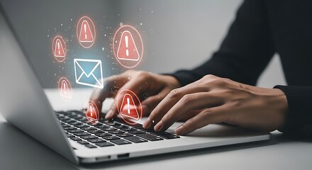 Person receiving email alerts with warning icons on laptop screen digital interface notification
