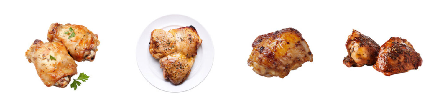 Baked chicken thighs arranged on white background with herbs  