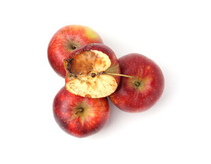 Spoiled apple and good ones isolated on white, top view