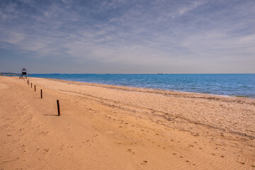 A deserted sandy beach on a summer day.