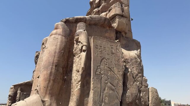 Majestic colossi of memnon displaying ancient egyptian grandeur