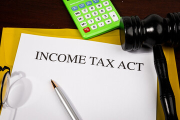 Income Tax Act Document Set on Wooden Desk – National Legislation for Individual and Corporate...