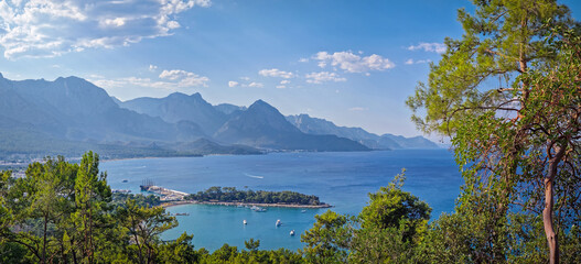 Panoramic Kemer coastal landscape. Vibrant seaside panorama with majestic Taurus mountains behind....