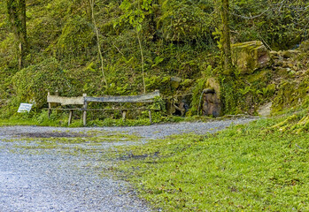 bench with water fountain on the mountain