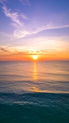 Obraz premium Vibrant sunset over tranquil ocean