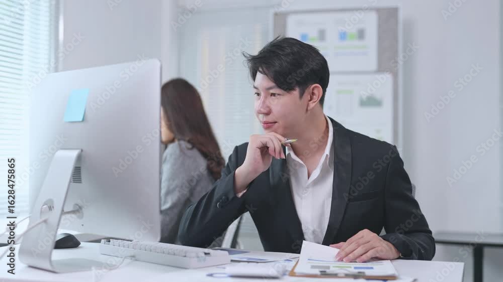 Poster young businessman working with financial documents at office desk, analyzing graphs and charts while