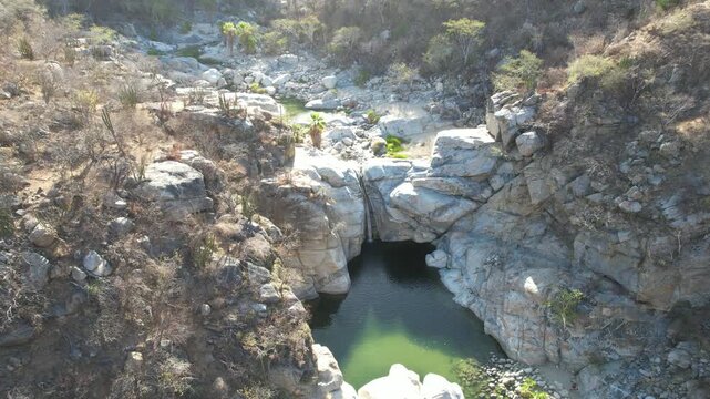 Aerial Footage of Hidden Waterfall Oasis at Ca&ntilde;&oacute;n de la Zorra, Oasis Landscape in BCS, Mexico