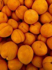 whole ripe apricots at farmers market full frame image