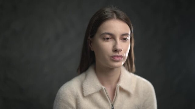 A young, beautiful woman receives professional makeup application. Ideal for beauty tutorials, cosmetic advertisements, skincare routines, or content about salon services and personal care. - Powered by Adobe