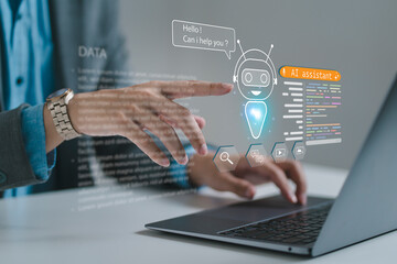 A person interacting with a virtual AI assistant interface on a laptop, representing artificial...