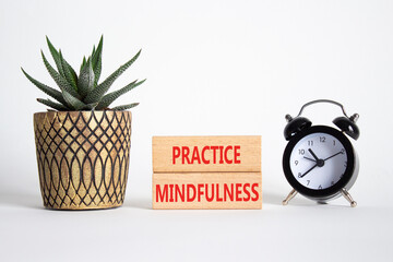 Practice Mindfulness symbol. Wooden blocks with words Practice Mindfulness. Beautiful white...