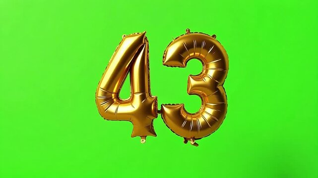 Shiny gold foil balloons displaying the number 43 float against a vibrant green backdrop, perfect for celebrations. - Powered by Adobe