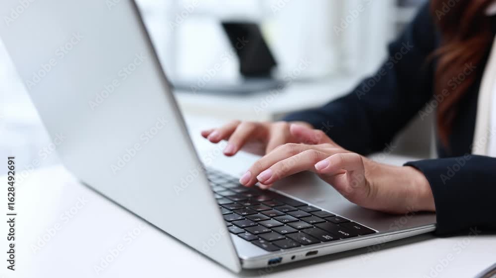 Poster professional female office worker rapidly typing on laptop keyboard. capturing dynamic close up sequ
