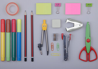 Stationery accessories for school and office on a light gray background.