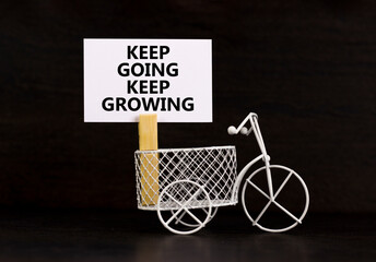 Keep going and growing symbol. Concept words phrase Keep going keep growing on beautiful white...